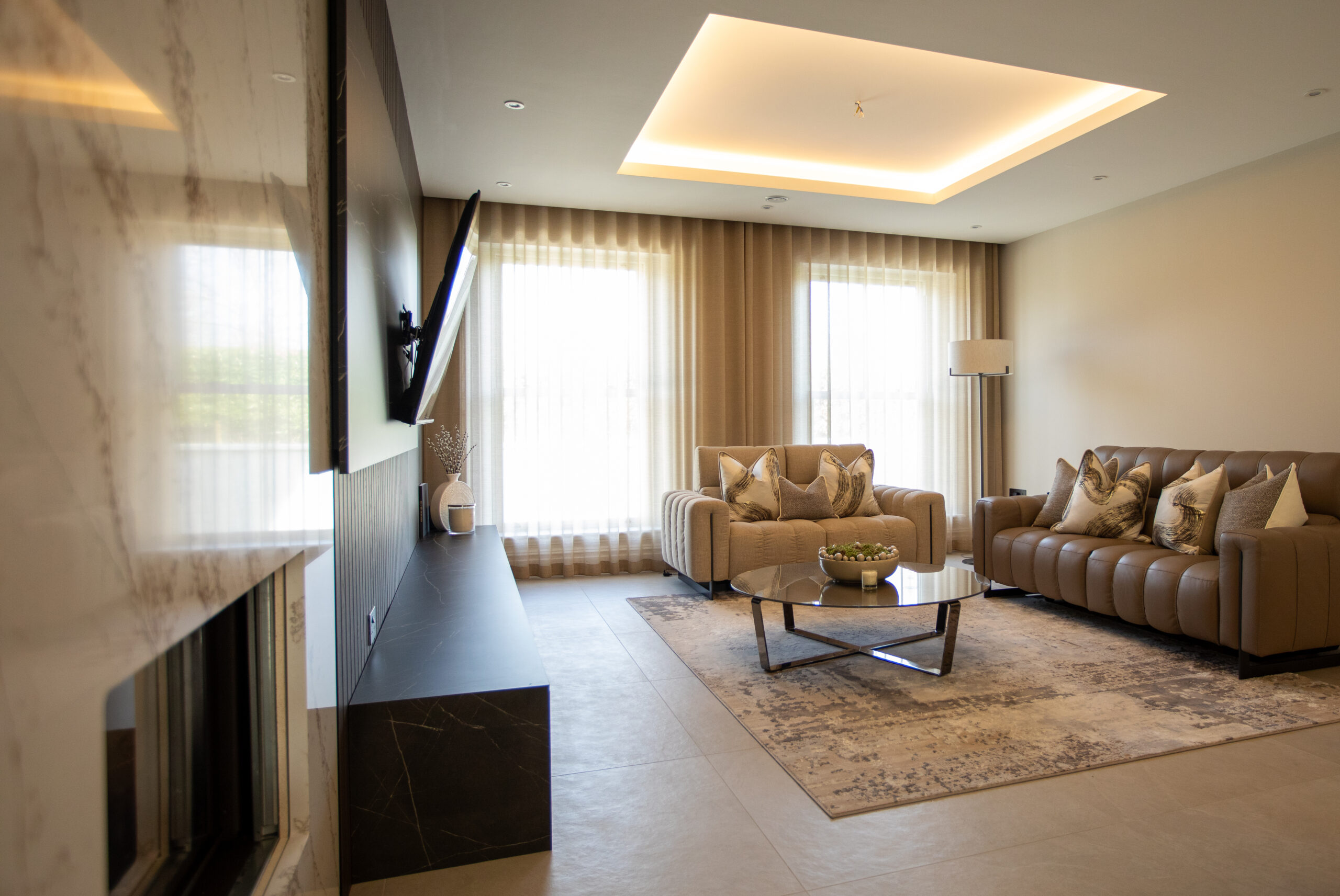 Wid shot of living room fit out, media unit bespoke table
