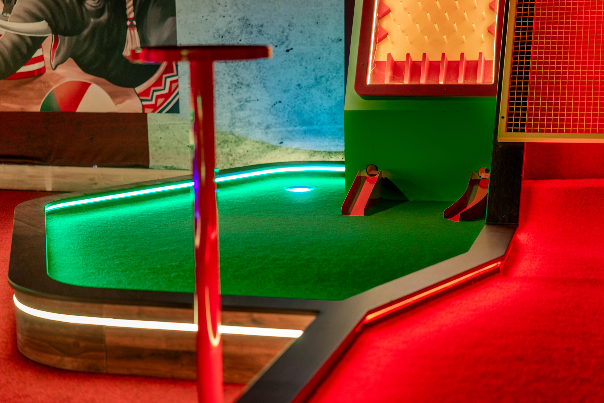 Full view of a themed miniature golf course, showcasing commercial bespoke joinery and custom installation by Driftwood NI