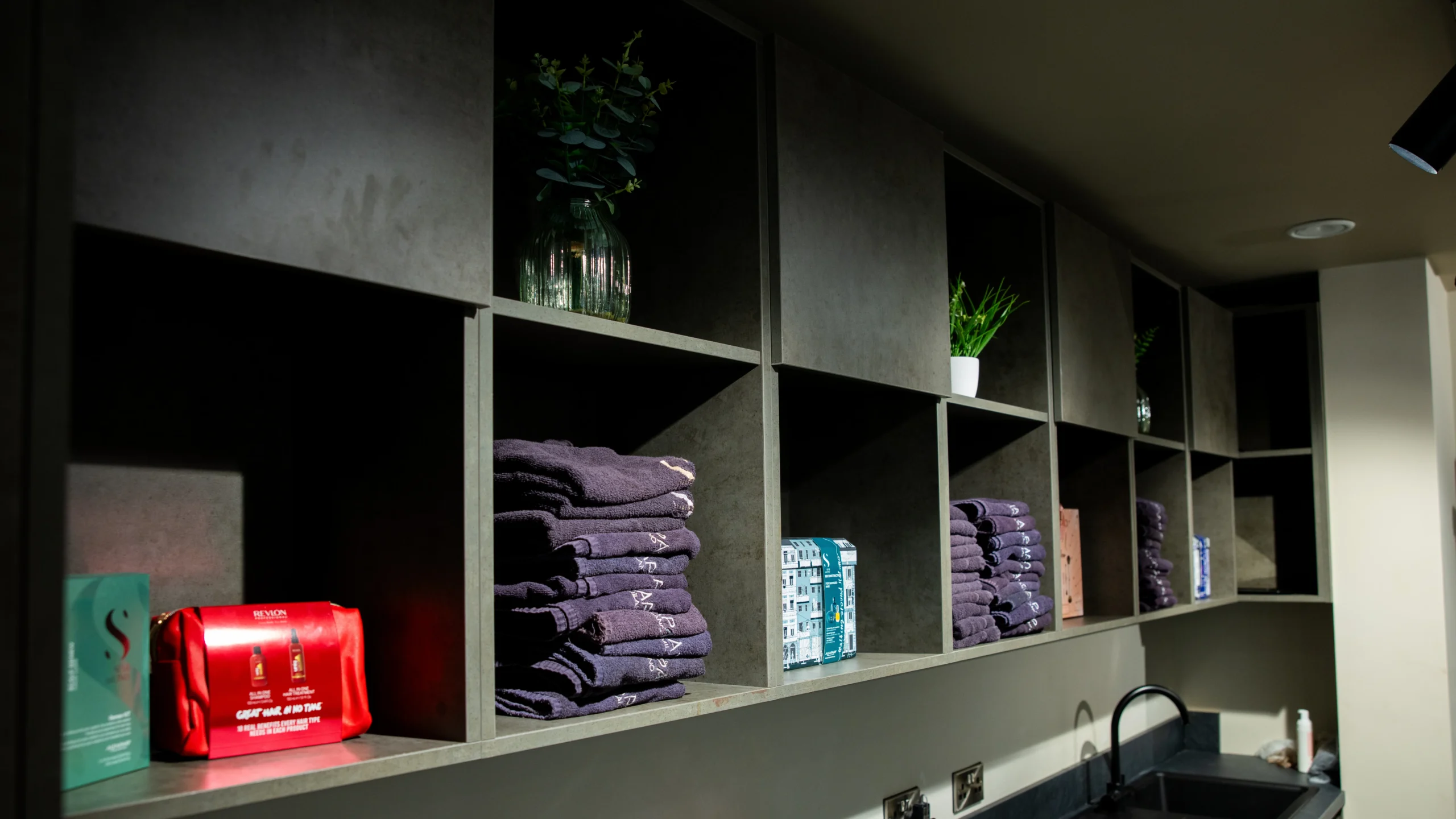 Dark grey open shelving with crisp mitred corners on each compartment